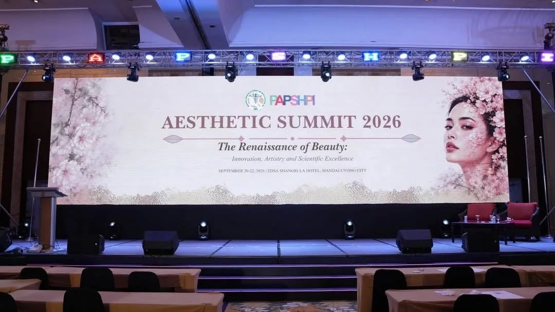 Event stage with a wide LED wall, truss lighting and speakers