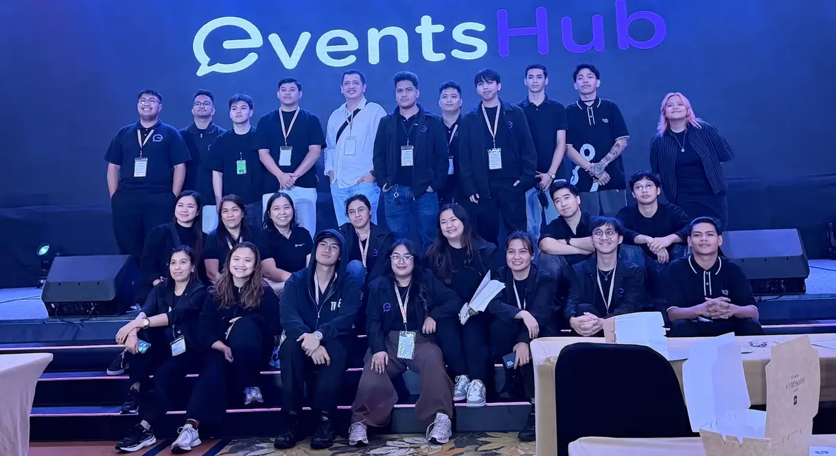 The 360 Logix events team on stage under the EventsHub screen, the crew behind our event technology services in the Philippines