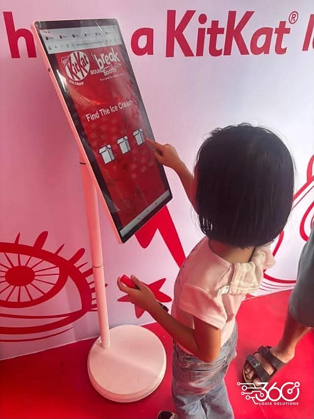 Child playing the Find The Ice Cream touchscreen game at the KitKat activation