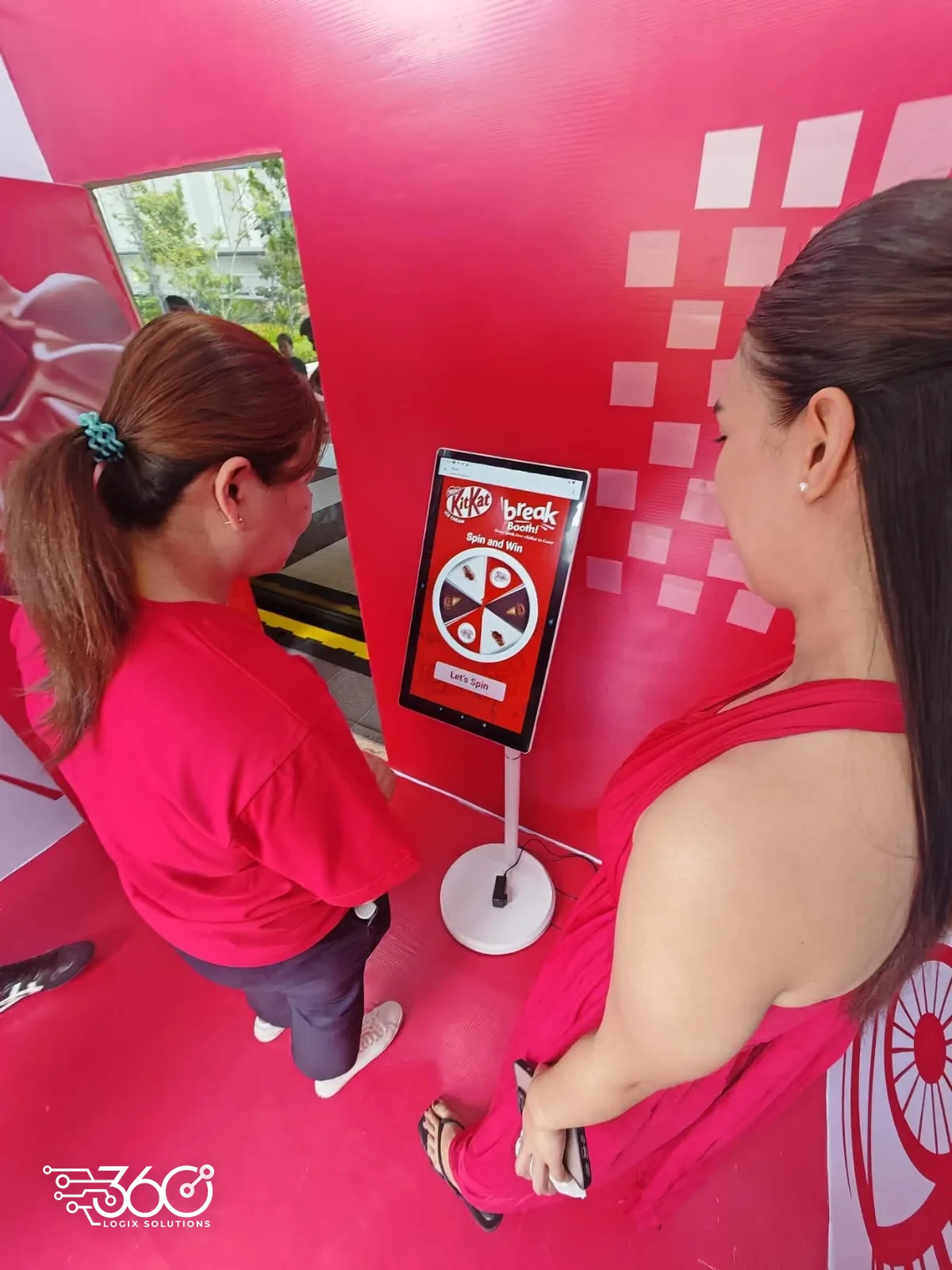 Guests playing the Spin and Win touchscreen game at the KitKat activation
