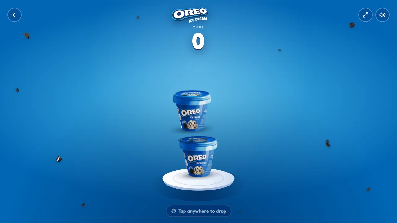 Oreo Stack Up game screen with Oreo Ice Cream cups stacked on a white platform and a cup counter at the top