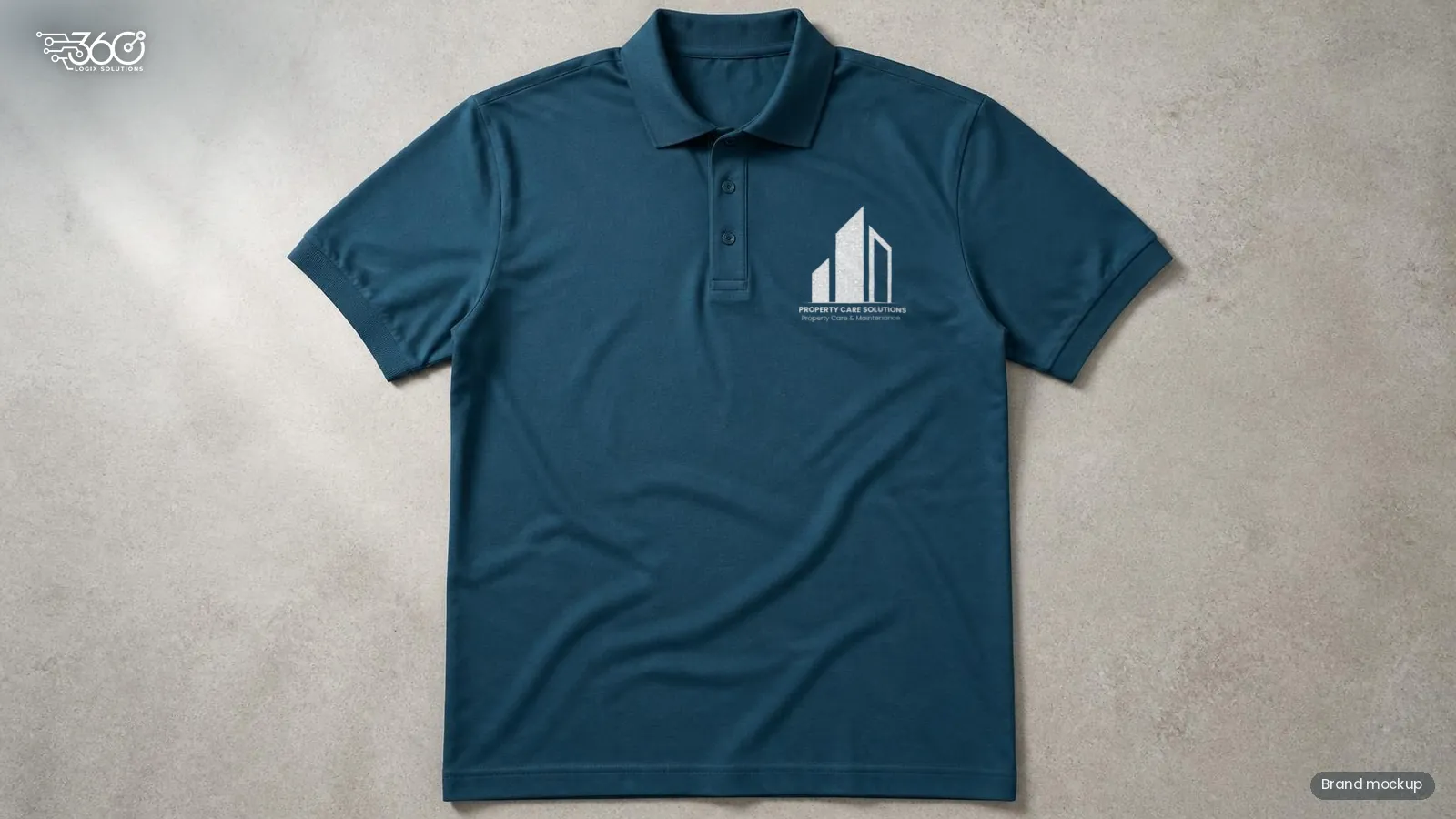 Brand mockup of the Property Care Solutions logo on a deep blue work polo shirt, printed in white on the left chest, designed by 360 Logix